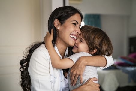 mother and son hugging