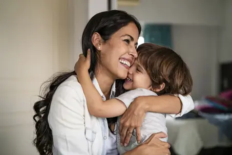mother and son hugging